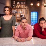 Contestants Martita Jara, Yvan Lemoine and Phillip "Ippy" Aiona of Team Giada watching their teammate cooking for the Producer's Challenge "Chicken" as seen on Food Network's Star, Season 8.