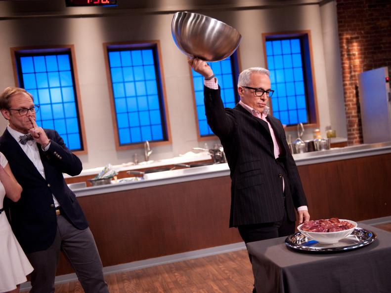 Special Guest Star Iron Chef Geoffrey Zakarian, with Star Producer Alton Brown, revealing the Secret Ingredient "Chicken Livers" to the Contestants in the middle of their cooking for the Star Challenge "Themed Food Court Kiosk" as seen on Food Network's Star, Season 8.