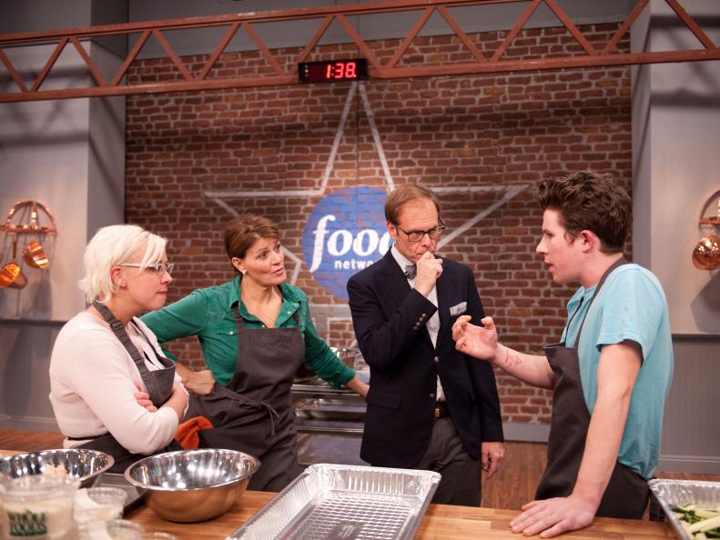 Star Producer Alton Brown mentoring his Contestants Emily Ellyn, Martie Duncan and Justin Warner on how to incorporate the Secret Ingredient "Chicken Livers" into a dish for the Star Challenge "Themed Food Court Kiosk-Italian" as seen on Food Network's Star, Season 8.