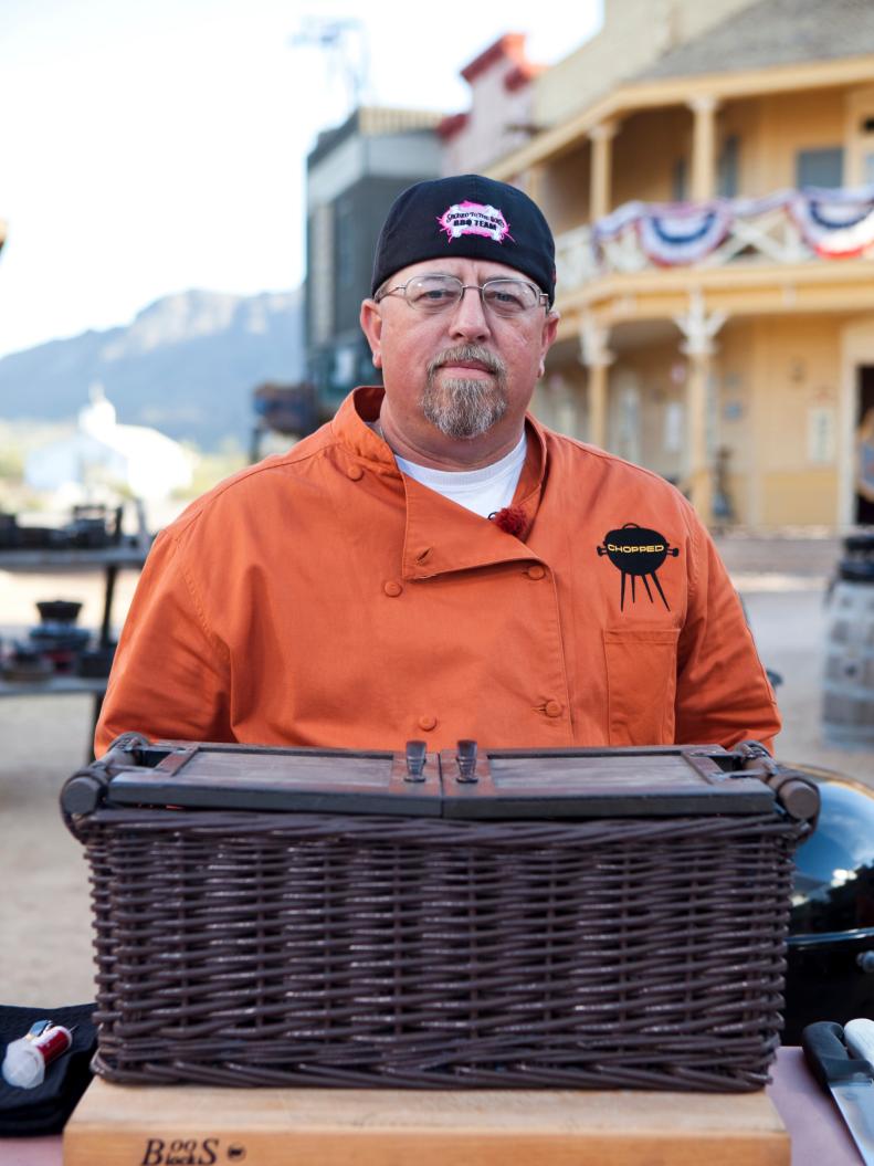 Chef Tommy Duncan with the first round's mystery basket,  during day one of the Chopped $50K Grilling Challenge in Tucson AZ,  as seen on Food Network's Chopped Season 12.