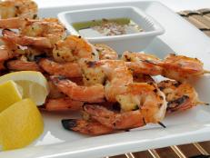 Delicious grilled shrimp with lemon and dipping sauce.