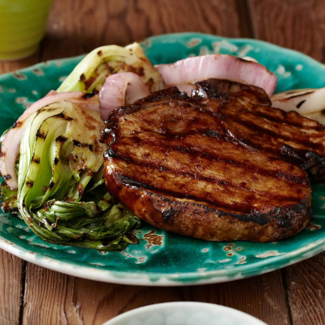 Grilled Korean Style BBQ Glazed Pork Chops with Red Onions and Baby Bok Choy