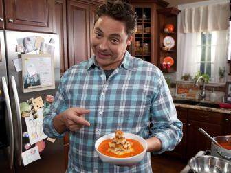 Host Jeff Mauro prepares his roasted tomato soup and grilled cheese sandwiches (two ways, one for adults, one for kids), as seen on Food Network's Sandwich King, Season 2, episode 2.
