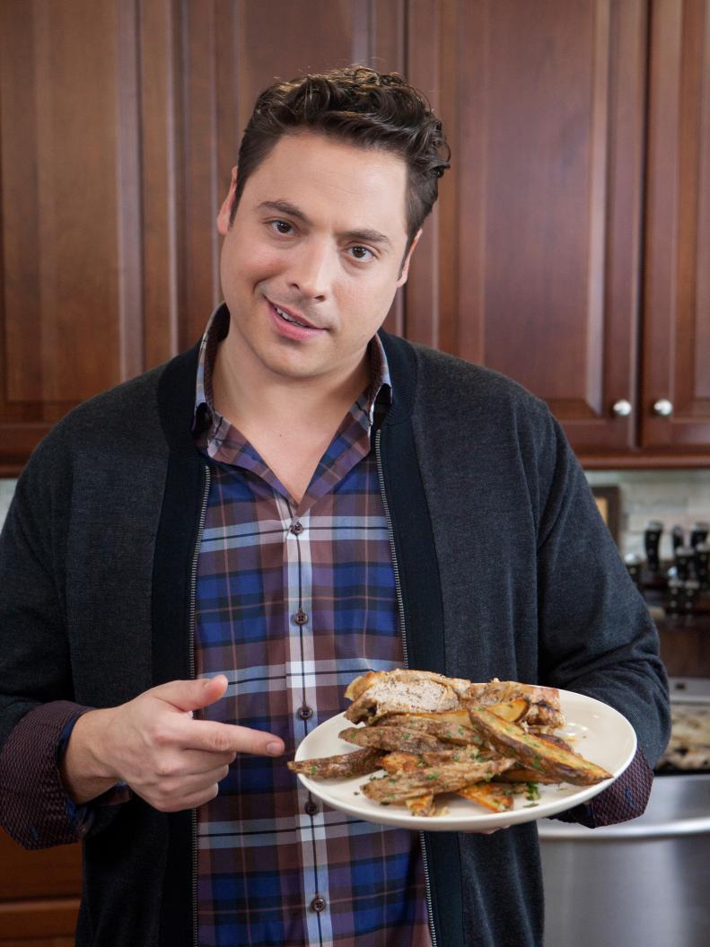 Host Jeff Mauro prepares a Turkey Patty Melt  with Oven Fries with Garlic, butter and Herbs, as seen on Food Network's Sandwich King, Season 2, episode 10.