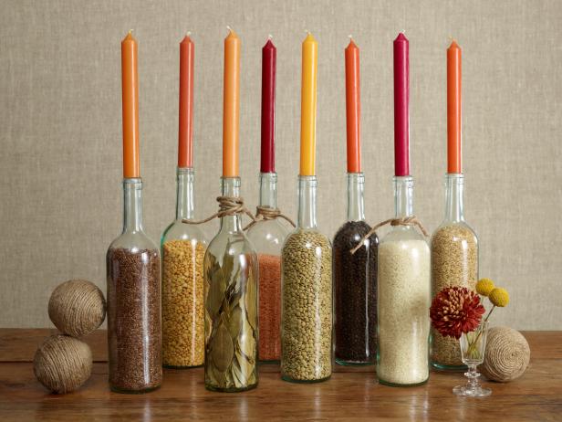 Fill glass bottles with grains and spices for a colorful arrangement.