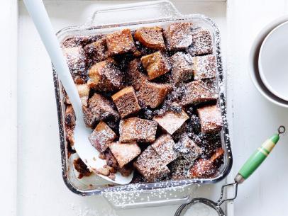 MEXICAN CHOCOLATE BREAD PUDDING, Marcela Valladolid, Mexican MadeEasy/MoneySavingMeals, Food Network, Unsalted Butter, Bread Cubes, Milk,Mexican Chocolate, Granulated Sugar, Eggs, Raisins, Cinnamon, Powdered Sugar
