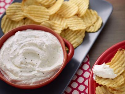 Parmesan sour cream dip served with ruffled chips.