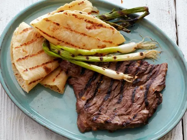 Korean Style Marinated Skirt Steak with Grilled Scallions and Warm Tortillas