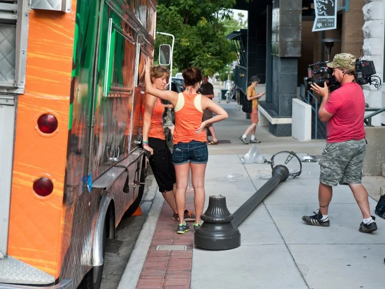 Momma's Grizzly Grub's Tiffany Seth and Adriane Richey react to an accident with their truck and a lamp post in Fayetteville, Ark., as seen on Food Network's The Great Food Tuck Race, Season 3.