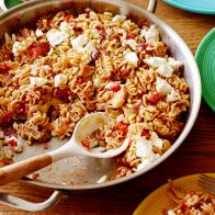 PANTRY PASTARee DrummondThe Pioneer Woman/All Stocked UpFood NetworkRed Onion, Olive Oil, Diced Tomatoes, Chicken Stock, White Wine, Assorted Olives, ArtichokeHearts, Garlic, Salt, Pepper, Pasta, Jarred Pesto, Feta, DrytoastedPine Nuts