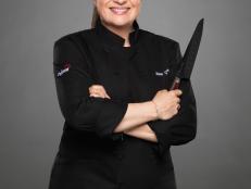 We checked in with Chef Guarnaschelli, one of 10 rival chefs competing on The Next Iron Chef: Redemption, to find out her favorite cookbook, must-have seasonal ingredients, go-to potluck dish and more.