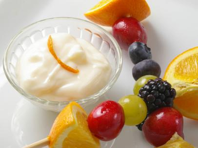 Fruit kabobs with citrus yogurt cream.