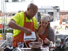 Contestants Hines Ward and Carnie Wilson preparing food for the "Kid's Party" Challenge, as seen on Food Network’s Rachael vs. Guy, Celebrity Cook-Off, Season 2.
