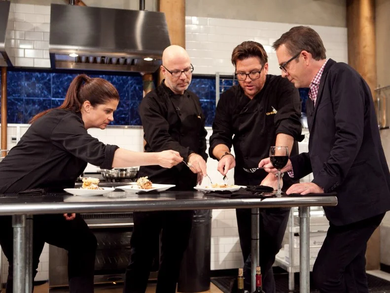 Host Ted Allen and After Hours Chefs Alex Guarnaschelli, Ron Ben-Israel and Scott Conant discuss and taste their dishes the were made with: popcorn, sour cream, funnel cake and blue snow cones, as seen on Food Network's Chopped: After Hours.