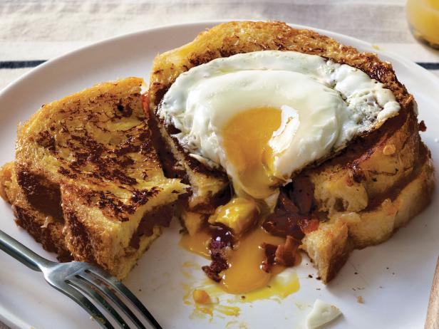 French Toast Stuffed with Bacon, Onion Tomato Jam with Gruyere and a Fried Egg