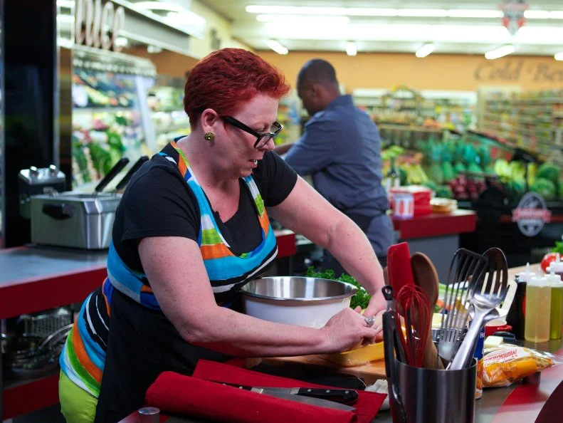 Chefs Karen Forsberg and Stanley Hagerman during the cooking part of Game 1, Out of Stock, Spaghetti and Meatballs, No pasta or Ground beef, 30 min time limit, as seen on Food Network's Guy's Grocery Games, Season 1.