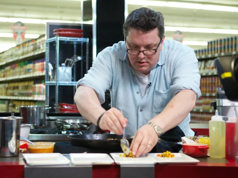 Chef Tom Ramsey during the cooking part of Game 3, Frozen Food Feud, Best Dish, as seen on Food Network's Guy's Grocery Games, Season 1.