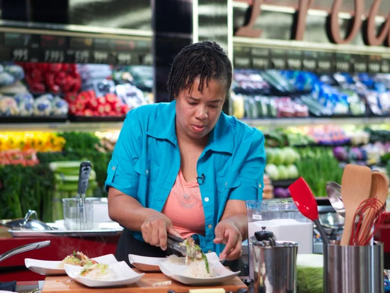 Chef Monica Smith during the cooking part of Game 1, 5 Ingredients Or Less, Asian Stir Fry, 20 minute time limit, as seen on Food Network's Guy's Grocery Games, Season 1.