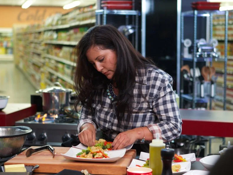 Chef Natalie Romero during the cooking part of Game 1, 5 Ingredients Or Less, Asian Stir Fry, 20 minute time limit, as seen on Food Network's Guy's Grocery Games, Season 1.