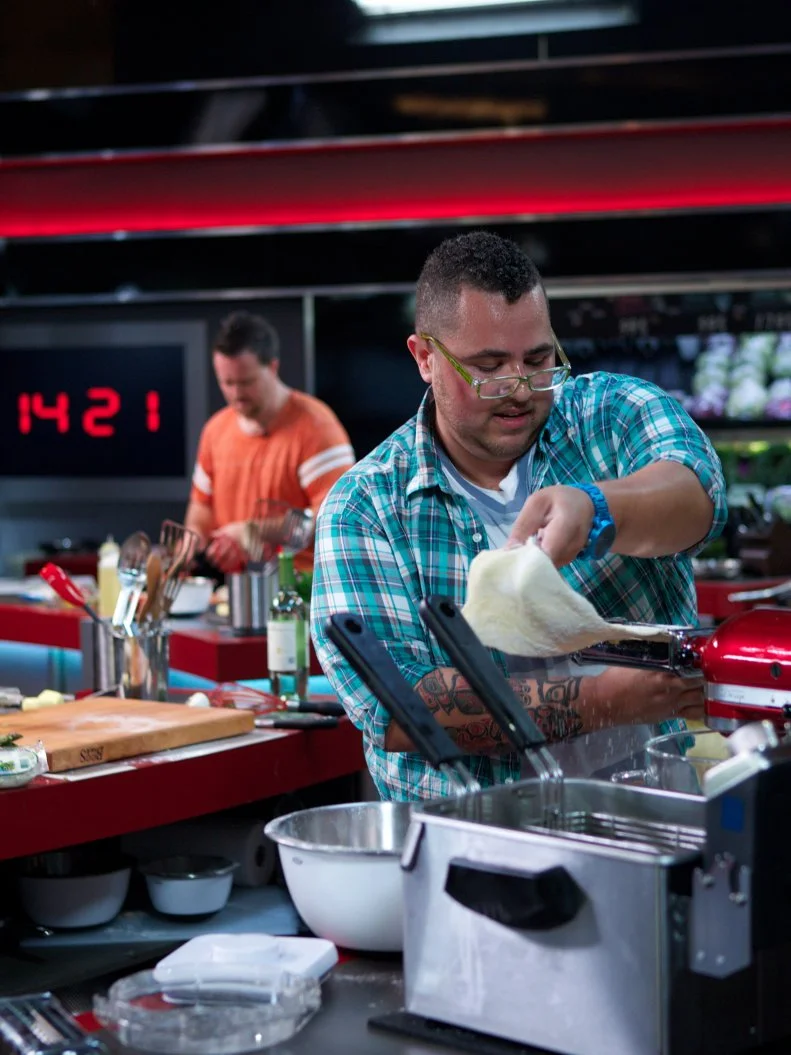 Chefs Nick Wilson and Kris Plummer during the cooking part of Game 3, Closing Time, Decadent Pasta, 25 min cooking time and 2 min shopping time, as seen on Food Network's Guy's Grocery Games, Season 1.