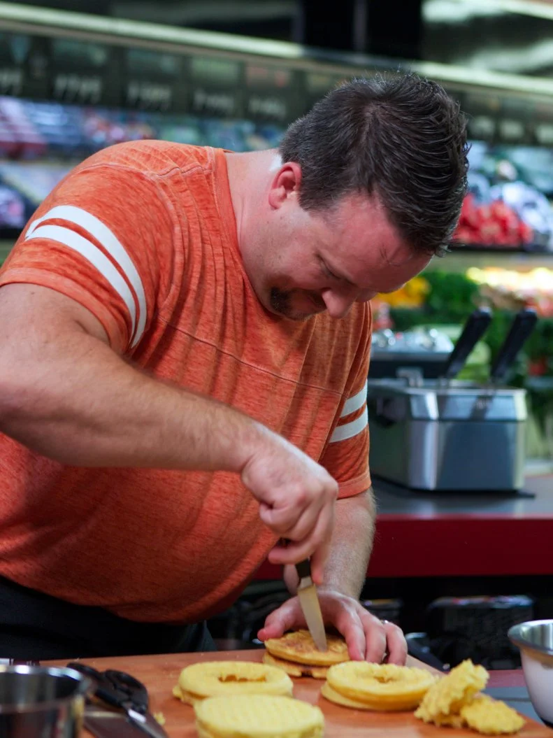 Chef Kris Plummer during the cooking portion of Game 2, Grocery List, Fun Family Meals, with Ad Sales Integration featuring Kellogg's Eggo's, Kellogg's Eggo's Homestyle Waffles, as seen on Food Network's Guy's Grocery Games, Season 1.