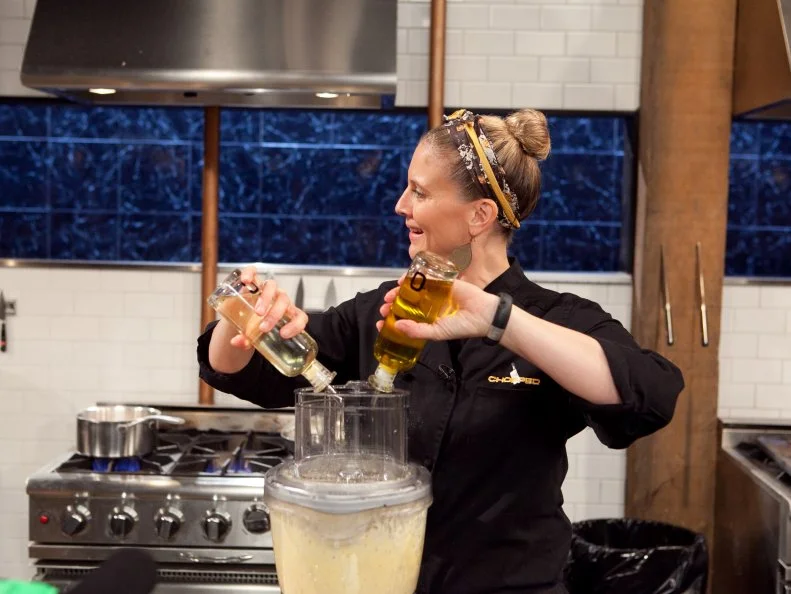 Chef Amanda Freitag working on her dish that must include: winter melon, hot mustard, canned chop suey and vegan lobster, as seen on Food Network's Chopped: After Hours.