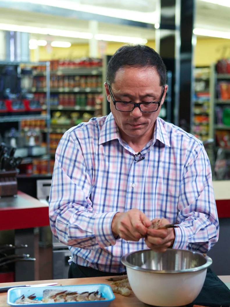 Chef Greg Akahoshi during the cooking part of Game 1, Out of Stock, Gourmet Salad, All Leafy Greens and Lettuce removed, 30 minute time limit, as seen on Food Network's Guy's Grocery Games, Season 1.