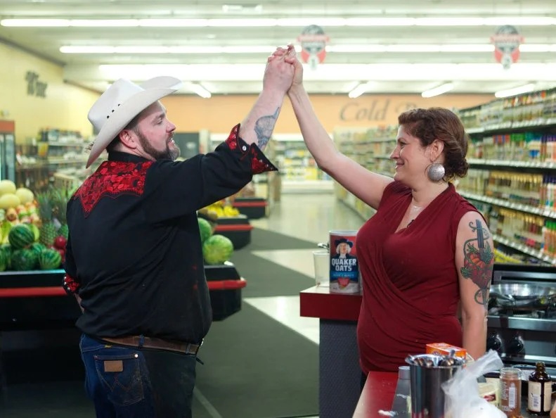 Chef Lenny McNab and chef Cristina Topham during the cooking part of Game 3, Grocery Bag secretly Bag Swap after shopping, Comfort Meal, 3 min to shop and 25 min cooking time, as seen on Food Network's Guy's Grocery Games, Season 1.