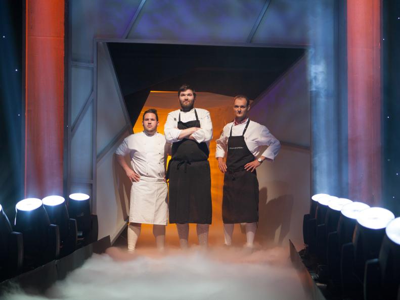 Challenger Chef BERNHARD MAIRINGER (center), is accompanied by ALEXANDER WALZER, and RAPHAEL IANNIELLO, in studio kitchen during the Octoberfest battle, as seen on Food Network’s Iron Chef America.