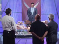 Mark Dacascos "The Chairman," introduces the Octoberfest theme to Challenger Chef BERNHARD MAIRINGER, and Iron Chef's MICHAEL SYMON, and GEOFFREY ZAKARIAN, in studio kitchen during the Octoberfest battle, as seen on Food Network’s Iron Chef America.