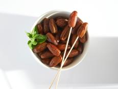 Fresh dates in a white bowl