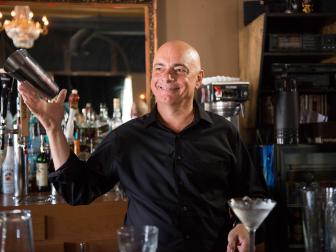 Host John Greene training the employees of Ali Baba's Cave on how to make new drinks at Black Cat Bar as seen on Food Network’s On the Rocks, Season 1.