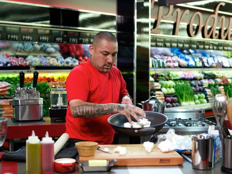 Chef Chris Tzorin during the cooking part of Game 2, Single Aisle Showdown, Best Dish, 20 minute time limit, as seen on Food Network's Guy's Grocery Games, Season 1.