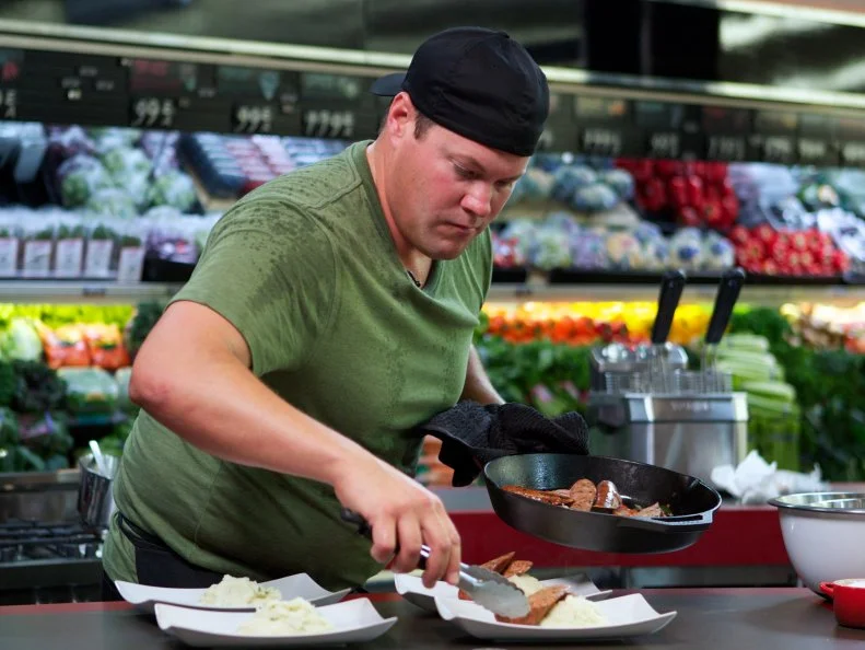 Chef Eric Tonips during the cooking part of Game 3, Out of Stock, Steak and Potatoes, no animal proteins or potatoes, 25 minute time limit, as seen on Food Network's Guy's Grocery Games, Season 1.