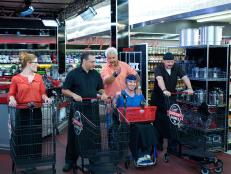 Host Guy Fieri with chefs Lori Hill, Stephan Germanaud, Chris Bales, and Luca Paris during the start of the shopping of Game 1, Grocery List, Best Egg Dish, 30 min cooking time, as seen on Food Network's Guy's Grocery Games, Season 1.
