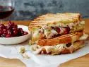 LEFTOVER THANKSGIVING PANINI
Ree Drummond
The Pioneer Woman/Turkey Day Leftovers
Food Network
Dijon Mustard, Sourdough Sandwich Bread, Swiss Cheese, Leftover Roasted Thanksgiving
Turkey, Cranberry Sauce, Leftover Dressing, Leftover Giblet Gravy, Butter
