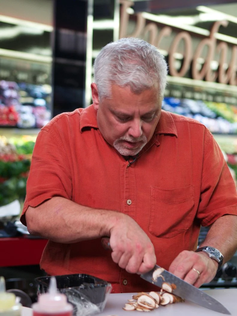 Chef Claude Baltran during the cooking part of Game 3, Grocery Bag secretly Bag Swap after shopping, Holiday Celebration, 1 main dish and 2 sides, 4 min to shop and 35 min cooking time, as seen on Food Network's Guy's Grocery Games, Season 1.