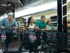 Host Guy Fieri with chefs Samuel Monsour, Cassy Pugh, Marcel Cocit, and Philippa Sklaar, during the start of the shopping part of Game 1, Frozen Food Feud, Best Seafood Dish, freezer only and 30 minute time limit, as seen on Food Network's Guy's Grocery Games, Season 1.