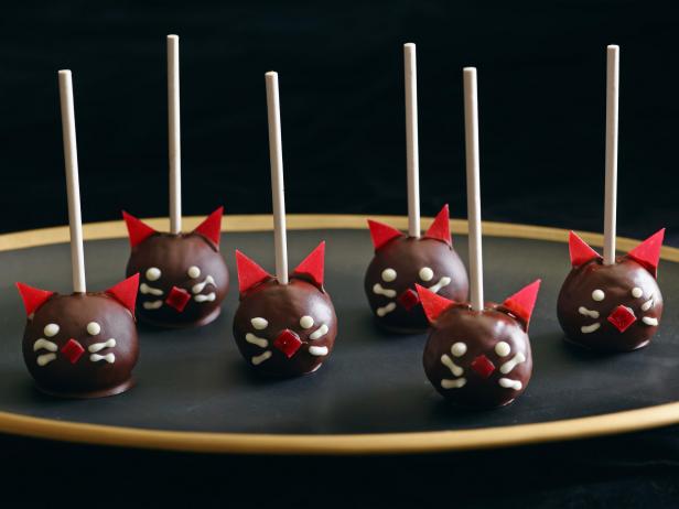BLACK CAT POPS **HalloweenGiada De LaurentiisGiada at Home/Ghoulish GoodiesFood NetworkMission Figs, Creamy Unsalted Almond Butter, Dark Chocolate Chips, Coconut or GrapeseedOil, White Chocolate, Orange Food Coloring, Strawberry or Raspberry Fruit Leather