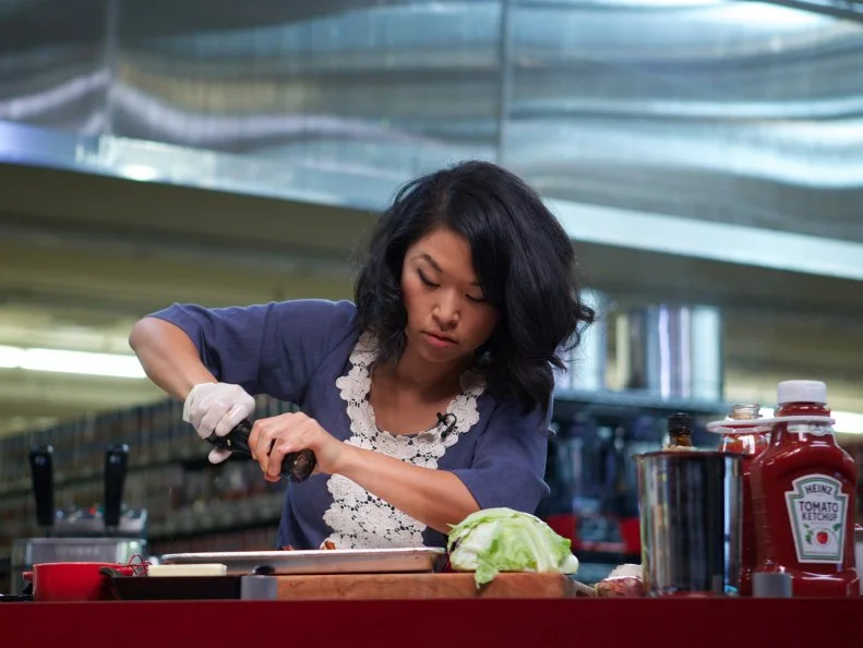 Chef Adela Jung during the cooking part of Game 1, Closing Time, Game Day Feast, 2 min shopping time and 30 min cooking time, as seen on Food Network's Guy's Grocery Games, Season 1.
