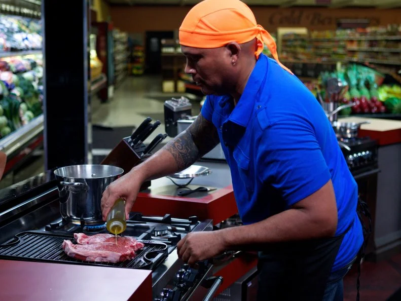Chef Tal Sims during the cooking part of Game 1, Closing Time, Game Day Feast, 2 min shopping time and 30 min cooking time, as seen on Food Network's Guy's Grocery Games, Season 1.