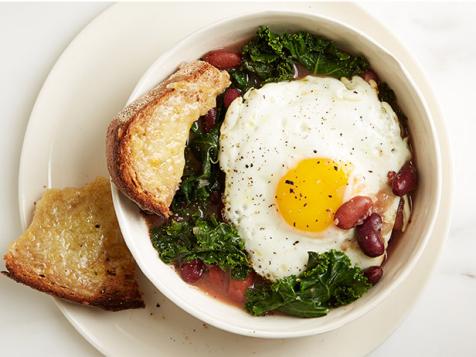 https://food.fnr.sndimg.com/content/dam/images/food/fullset/2013/12/27/0/FNK_bean-kale-egg-stew_s4x3.jpg.rend.hgtvcom.476.357.suffix/1389218636450.jpeg