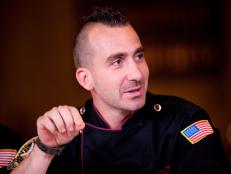 Guest Judge Iron Chef Marc Forgione tasting Rival-Chef's dishes in Episode 5 Chairman's Challenge "Story Telling" as seen on Food Network Next Iron Chef Season 4.