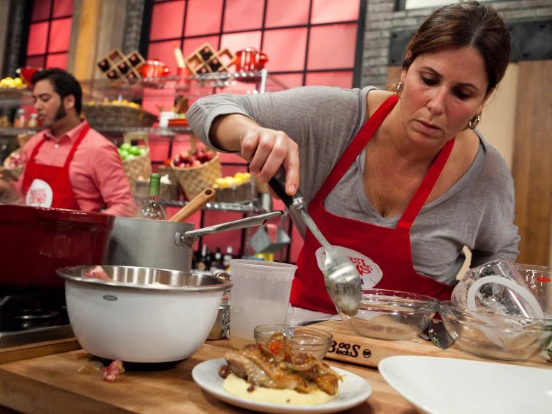 The red teams Sue Mangogna plating her attempt to recreate Chef Annes Chicken Scarpiello with Soft Parmigiano Polenta, As seen on Food Networks Worst Cooks in America, season 4