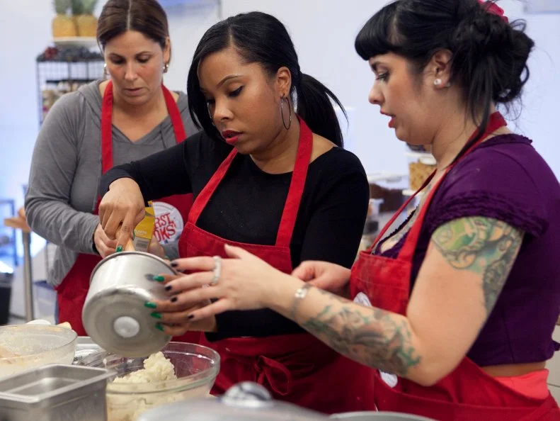 Rasheeda Brown of the Red team gets help from teammates Crystal Lonneberg and Sue Mangogna during the gelato and waffle cone challenge, as seen on Food Networks Worst Cooks in America, Season 4