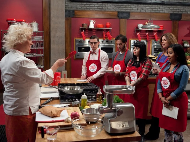 Chef Anne Burrell  demonstrates how she makes her lamb burger to her team, as seen on Food Networks Worst Cooks in America, season 4.