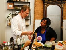 Worst Cooks In America Team Blue Team Leader Bobby Flay tastes the Green Shrimp Lo Mein prepared by Carla Johnson for the "Take On Take Out" challenge. Chef Anne and Chef Bobby arrived at the recruit's house to find the recruits had been ordering take out food instead of cooking, and now they must race to replicate Chinese food recipes before the food deliveryman gets to the house, as seen on Food Network's Worst Cooks in America, Season 4.