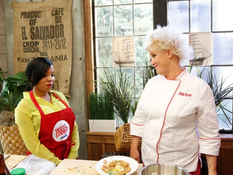 Worst Cooks In America Team Red Team Leader Chef Anne Burrell tastes the Shrimp Fried Rice prepared by Rasheeda Brown for the "Take On Take Out" challenge. Chef Anne and Chef Bobby arrived at the recruit's house to find the recruits had been ordering take out food instead of cooking, and now they must race to replicate Chinese food recipes before the food deliveryman gets to the house, as seen on Food Network's Worst Cooks in America, Season 4.