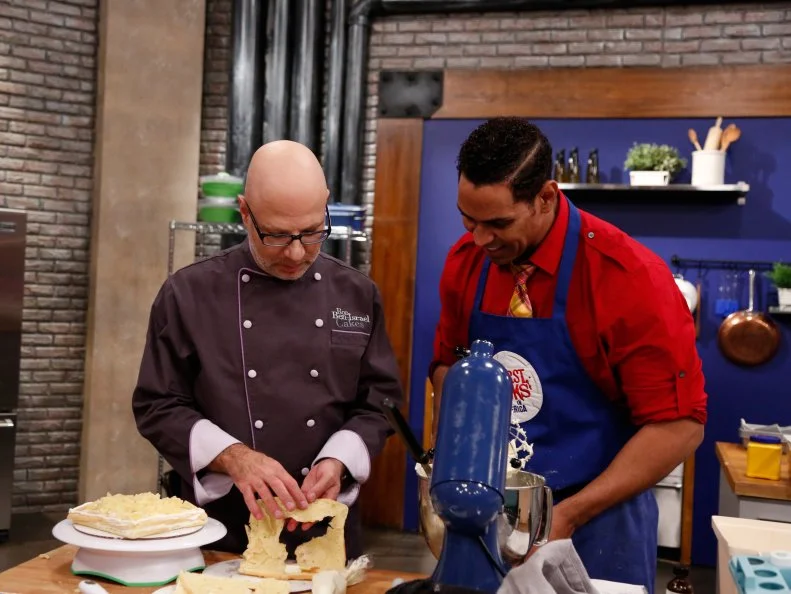 Guest Chef Ron Ben-Israel checks in on Blue Team Recruit Chet Pourciau checks as Chet makes his variation of a Basic Vanilla Cake with Swiss Meringue Buttercream Frosting demonstrated by Chef Ron Ben-Israel for the Cake Bake Off Challenge. Chef Ron gave the recruits very specific directions to follow as a basis for their own unique cakes, as seen on Food Network's Worst Cooks in America, Season 4.