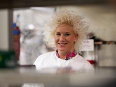 Host Anne Burrell behind the line in the kitchen of Zengo as seen on Food Network's Chef Wanted with Anne Burrell, Season 2.